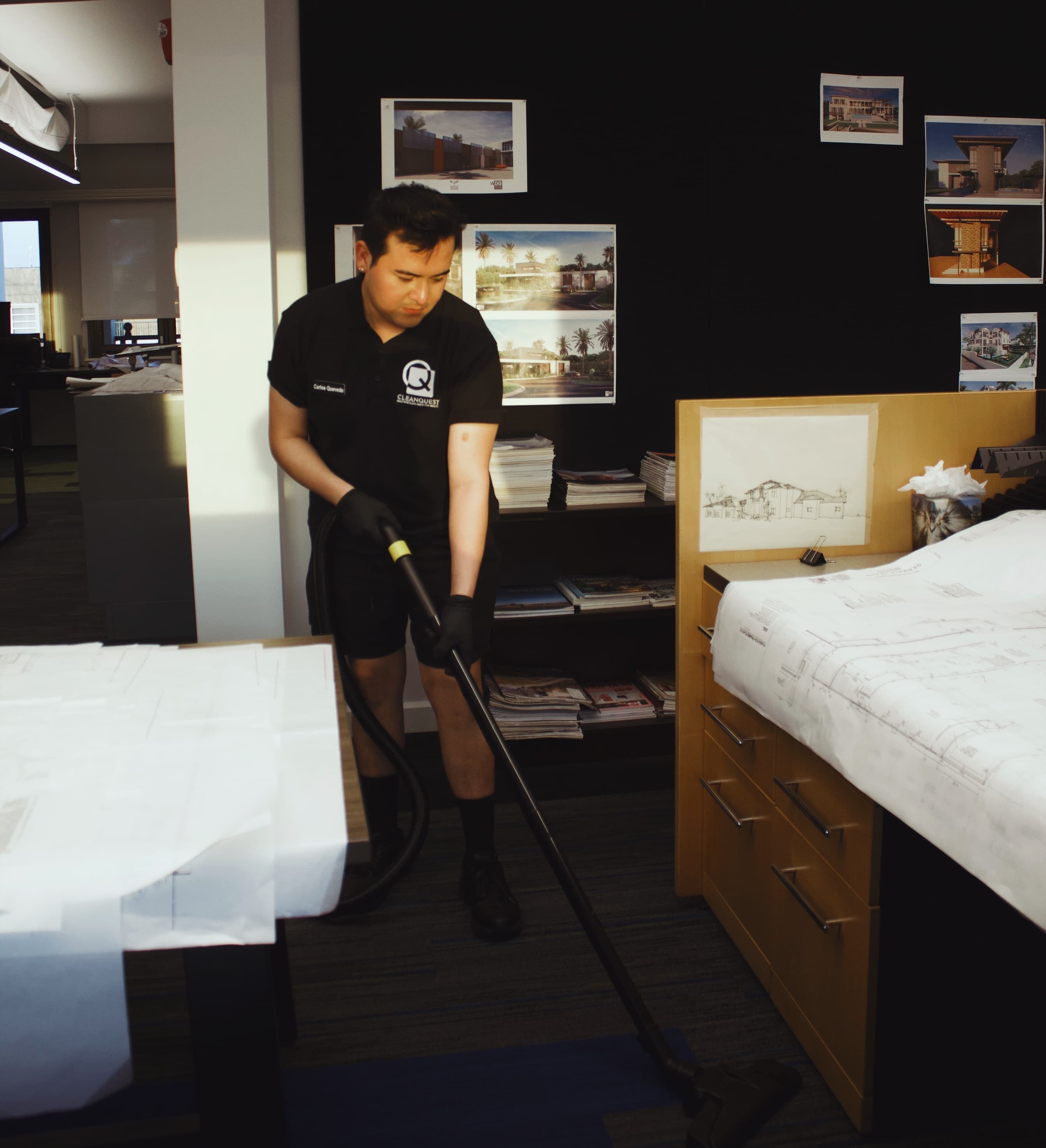 CleanQuest Commercial staff member cleaning an architectural office in Naples, FL